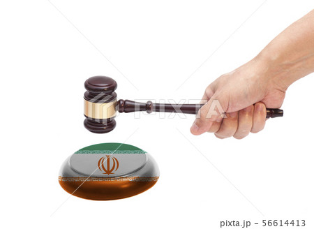 Hand knocking a Judge gavel at soundboard with Hand knocking a Judge gavel at soundboard with 56614413