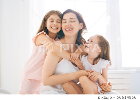girls and their mother enjoy sunny morning girls and their mother enjoy sunny morning 56614956