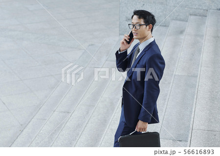 Entrepreneur walking down the stairs Entrepreneur walking down the stairs 56616893