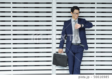 Entrepreneur checking time Entrepreneur checking time 56616985