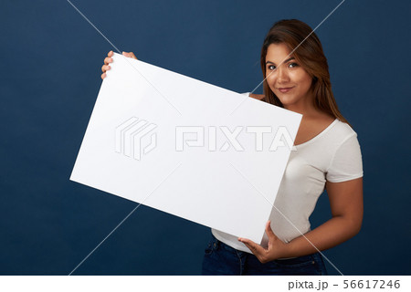 Young woman with blank sign 56617246