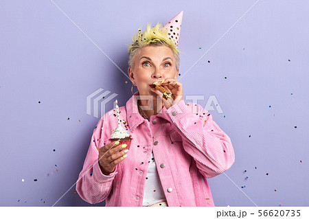 old granny entertaining her grandsons and granddaughters old granny entertaining her grandsons and granddaughters 56620735