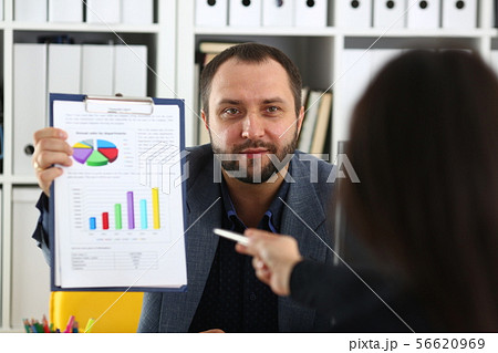 businessman hold binder in his arms discuss with his partner their future project 56620969