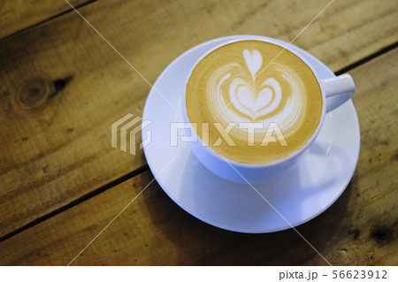 Cups of cafe latte on wooden table background 56623912