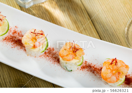Roasted prawns on rice with saffron and lime 56626321
