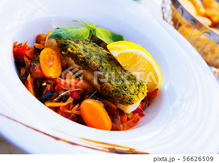 White fish baked with vegetables White fish baked with vegetables 56626509