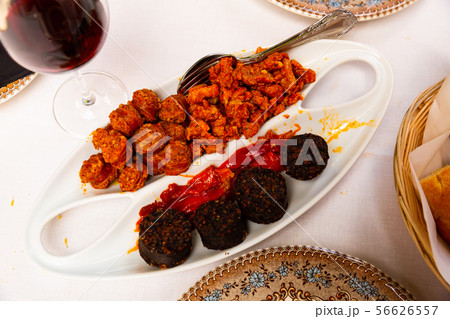 Blood sausage, chorizo, picadillo and baked cherry peppers Blood sausage, chorizo, picadillo and baked cherry peppers 56626557