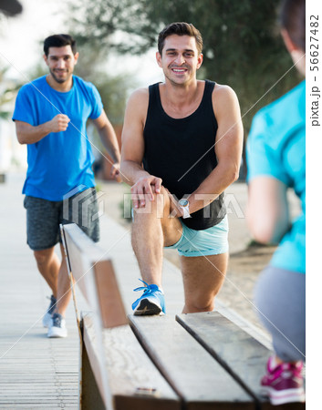 Two friends are doing warm-up 56627482