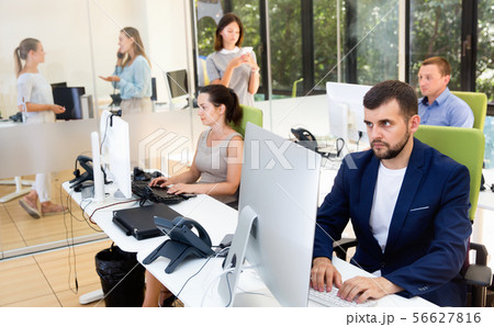 Group of successful business people during daily work in modern co-working space Group of successful business people during daily work in modern co-working space 56627816