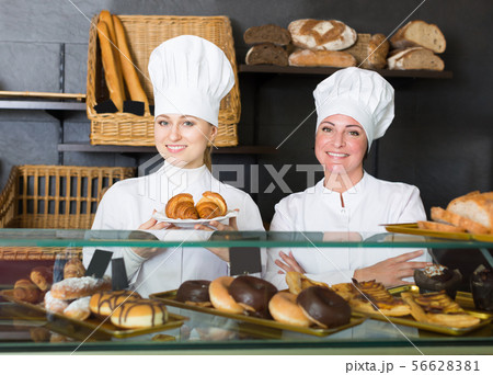 Adult women with desserts in the pastry shop 56628381