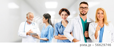 Doctor working in hospital with other doctors. 56629746