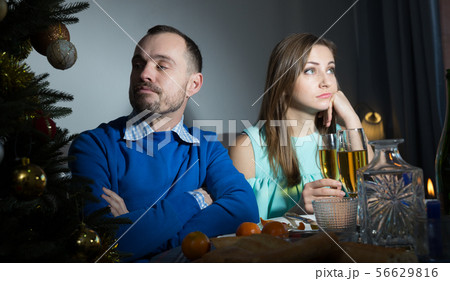 Unhappy couple celebrating New Year Unhappy couple celebrating New Year 56629816