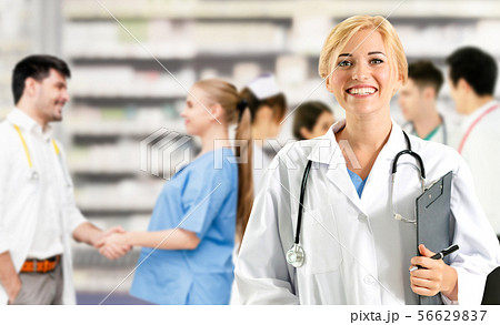 Doctor working in hospital with other doctors. Doctor working in hospital with other doctors. 56629837