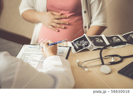 Pregnant Woman and Gynecologist Doctor at Hospital 56630016