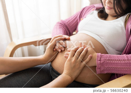 Pregnant couple feels love and relax at home. Pregnant couple feels love and relax at home. 56630240