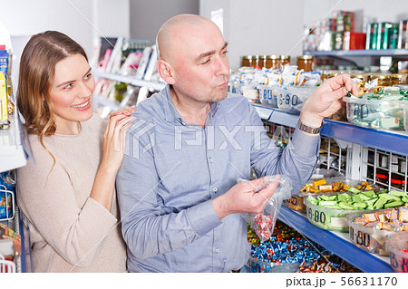 female and male picking candies female and male picking candies 56631170