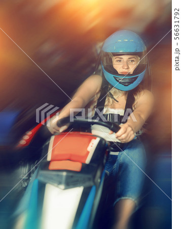 Woman driving sport car for karting in a circuit lap in sport c Woman driving sport car for karting in a circuit lap in sport c 56631792