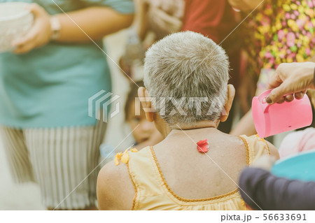 Thai people celebrate Songkran by pouring water 56633691
