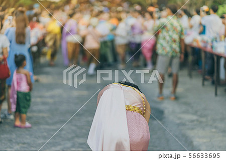 Back view of female in Thai dress  take a photo  56633695