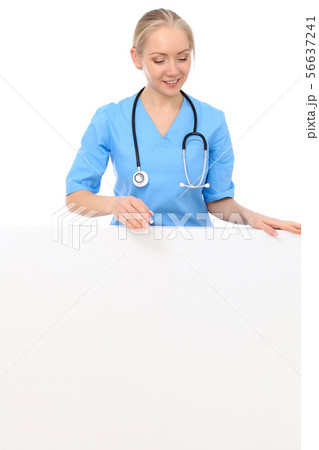 Doctor woman or nurse isolated over white background. Cheerful smiling medical staff representative 56637241