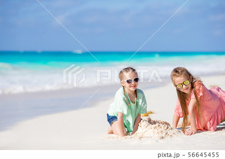 Adorable little kids enjoying the view of picturesque English Harbour at Antigua in caribbean sea 56645455