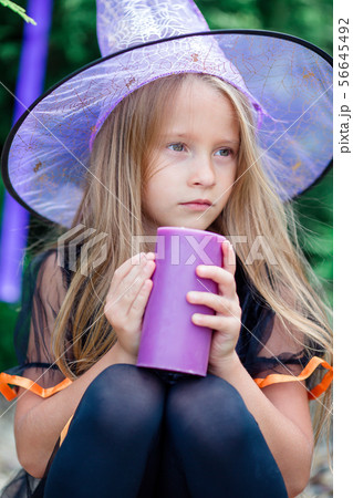 Happy girl in halloween costume with jack pumpkin.Trick or treat 56645492