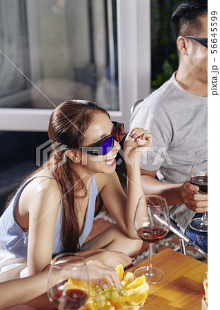 Woman watching comedy movie with friends 56645599