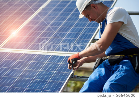 Stand-alone exterior solar panel system installation, renewable green energy generation concept. Stand-alone exterior solar panel system installation, renewable green energy generation concept. 56645600