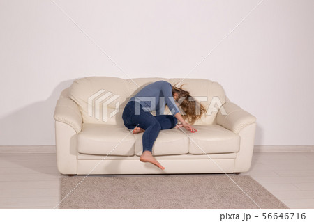 alcoholic, domestic violence and abuse concept - man gets drunk at home and takes his anger at his 56646716