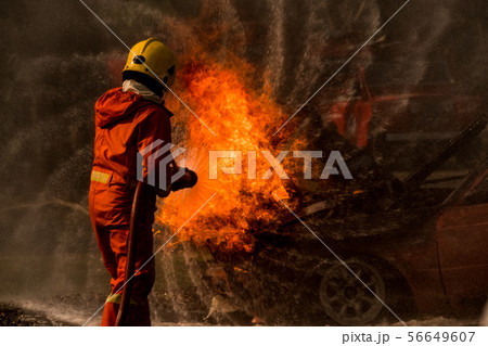 Firefighter splash water to fire hydrant 56649607