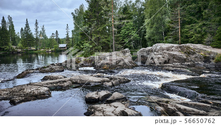 Wooden house on a mountain river. Scenic view 56650762