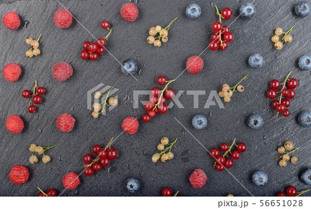 Flat lay view at ripe bilberry raspberry white and 56651028