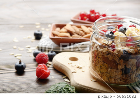 Fruit healthy muesli in glass jar on kitchen Fruit healthy muesli in glass jar on kitchen 56651032
