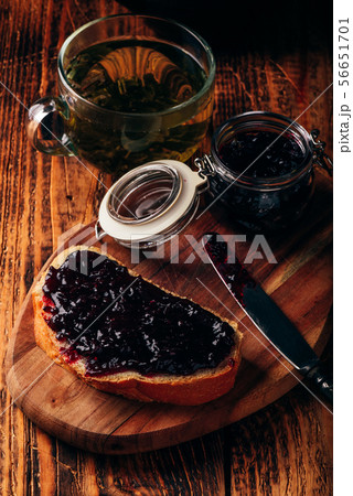 Toast with berry jam and green tea Toast with berry jam and green tea 56651701
