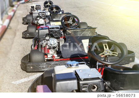 A number of small race cars ready for the race. 56658073