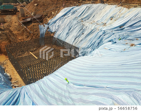 Temporary slope protection using plastic sheets 56658756