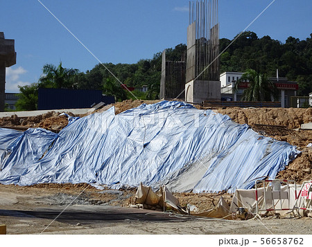 Temporary slope protection using plastic sheets 56658762