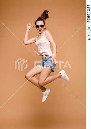 Cheerful brunette young woman in casual outlook 56662088