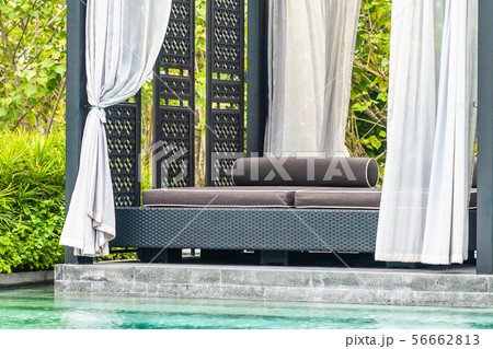 Beautiful outdoor swimming pool in hotel and resort with chair and deck for leisure vacation Beautiful outdoor swimming pool in hotel and resort with chair and deck for leisure vacation 56662813