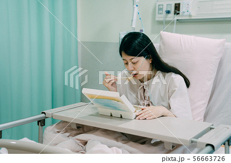 illness lady using chopsticks eating boxed lunch 56663726