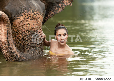 Asian women traditional hug friendly with the wild 56664222