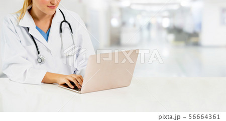 Doctor using laptop computer at the hospital. 56664361