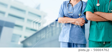 Doctor and surgeon with arms crossed in hospital. 56664762
