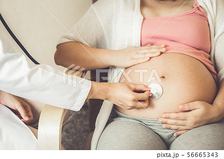 Pregnant Woman and Gynecologist Doctor at Hospital 56665343