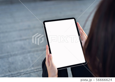 Hand holding digital tablet blank screen. mockup Hand holding digital tablet blank screen. mockup 56666624