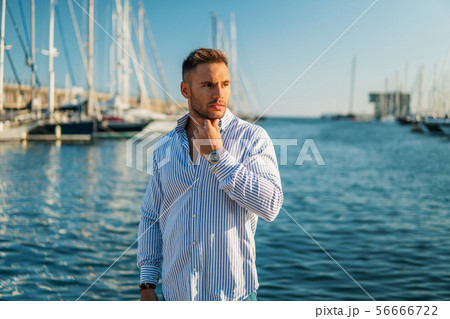 Young rich man at Yacht Club. Businessman is Relaxing 56666722