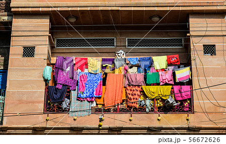Drying clothes in front of the old house Drying clothes in front of the old house 56672626