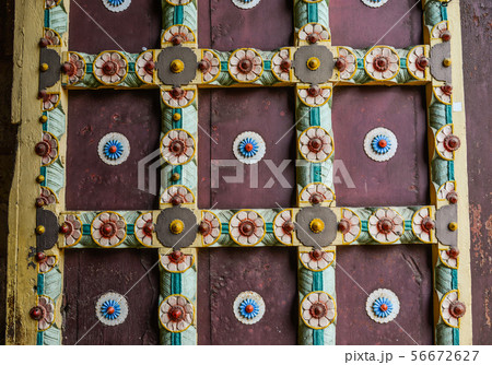 Ancient door of traditonal wooden house Ancient door of traditonal wooden house 56672627