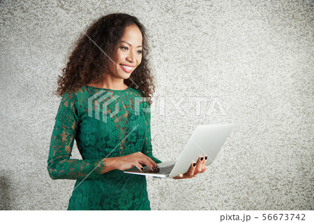 Woman working on laptop Woman working on laptop 56673742