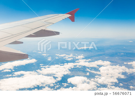 view from the window of the plane that flies over 56676071